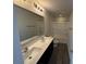 Bathroom with double sinks, a large mirror, and a shower/tub combo at 1608 Cole St, Gastonia, NC 28054