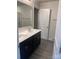 Bathroom with double vanity and flooring at 1608 Cole St, Gastonia, NC 28054