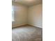 Well-lit bedroom with carpeted floor at 1608 Cole St, Gastonia, NC 28054