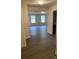 Bright hallway with wood-look flooring leading to a living room and other rooms at 1608 Cole St, Gastonia, NC 28054