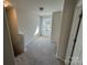 Upstairs hallway filled with natural light, neutral paint, and clean carpet at 1608 Cole St, Gastonia, NC 28054