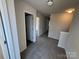 Bright hallway featuring neutral walls, plush carpet, and white trim at 1608 Cole St, Gastonia, NC 28054