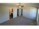 Large main bedroom featuring a ceiling fan and multiple walk in closets at 1608 Cole St, Gastonia, NC 28054