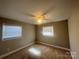 Bright bedroom with a ceiling fan and natural light coming through the windows at 1907 Steele St, Monroe, NC 28110