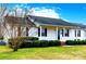 Charming single-story home with white siding, dark shutters, and a well-manicured front lawn, creating a welcoming curb appeal at 1976 Mcilwain Rd, Lancaster, SC 29720