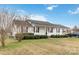 Street view of a one story house with manicured lawn, black roof and attached carport at 1976 Mcilwain Rd, Lancaster, SC 29720