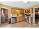 Galley kitchen with tile floors and stainless steel appliances at 1976 Mcilwain Rd, Lancaster, SC 29720