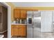 Kitchen with stainless steel refrigerator and wooden cabinets at 1976 Mcilwain Rd, Lancaster, SC 29720