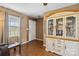 View of living room with wood floors, a display cabinet, and a view to the front door at 1976 Mcilwain Rd, Lancaster, SC 29720