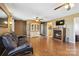 Inviting living room with hardwood floors, fireplace, and display cabinet at 1976 Mcilwain Rd, Lancaster, SC 29720