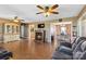 Open-concept living area with hardwood floors, fireplace, adjacent dining area, and display cabinet at 1976 Mcilwain Rd, Lancaster, SC 29720