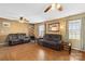 Bright living room showcasing hardwood floors, ceiling fans, and ample seating at 1976 Mcilwain Rd, Lancaster, SC 29720