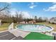 Backyard with an above ground pool, sheds, and a greenhouse at 1976 Mcilwain Rd, Lancaster, SC 29720