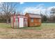 View of two outdoor storage sheds, perfect for hobbies, storage and gardening at 1976 Mcilwain Rd, Lancaster, SC 29720