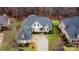 Aerial view of two-story house, landscaped yard, and driveway at 2349 Shiny Leaf Dr, Denver, NC 28037