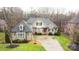 Two-story house with driveway and surrounding trees at 2349 Shiny Leaf Dr, Denver, NC 28037