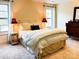 Bright bedroom with striped bedding, two lamps, and a dresser at 2349 Shiny Leaf Dr, Denver, NC 28037