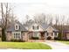 Brick home with a two-car garage and landscaped lawn at 2349 Shiny Leaf Dr, Denver, NC 28037