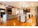 Open kitchen with granite island and hardwood floors at 2349 Shiny Leaf Dr, Denver, NC 28037