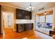 Kitchenette with dark cabinetry, wine cooler, and access to a screened porch at 2349 Shiny Leaf Dr, Denver, NC 28037