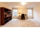 Home office with built-in shelving and a desk at 2349 Shiny Leaf Dr, Denver, NC 28037