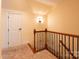 Upstairs hallway with carpeted floor and access to rooms at 2349 Shiny Leaf Dr, Denver, NC 28037