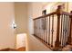 Upstairs hallway with railing and carpet at 2349 Shiny Leaf Dr, Denver, NC 28037