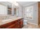 Elegant bathroom with double vanity, granite countertop, and large mirror at 27 Quayside Ct, Clover, SC 29710