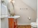 Small bathroom with vanity, mirror, and hardwood floors at 27 Quayside Ct, Clover, SC 29710