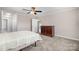 Spacious bedroom with a double bed, ceiling fan, and access to hallway at 27 Quayside Ct, Clover, SC 29710