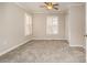 Well-lit bedroom with neutral walls, carpet, and two windows with shutters at 27 Quayside Ct, Clover, SC 29710