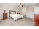 Cozy bedroom featuring a comfortable bed, ceiling fan, and neutral decor at 27 Quayside Ct, Clover, SC 29710