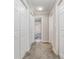 Clean hallway with carpet, neutral walls, and multiple doors to bedrooms and bath at 27 Quayside Ct, Clover, SC 29710