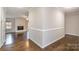 Hardwood floors and neutral colored walls in the hallway at 27 Quayside Ct, Clover, SC 29710