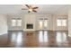 Spacious living room featuring hardwood floors and a brick fireplace at 27 Quayside Ct, Clover, SC 29710