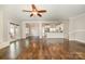 Open living room with hardwood floors, fireplace, and access to backyard at 27 Quayside Ct, Clover, SC 29710