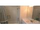 Neat bathroom with a shower-tub combo featuring white subway tiles, sleek white vanity, and modern fixtures at 327 Coxe Ave, Charlotte, NC 28208