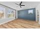 Bedroom with ample natural light, neutral-toned walls, and a ceiling fan at 327 Coxe Ave, Charlotte, NC 28208