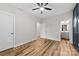 Bedroom features hardwood floors, ceiling fan, and two closets at 327 Coxe Ave, Charlotte, NC 28208