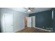 Spacious bedroom with hardwood floors, neutral walls, white trim, two closets, and ample natural light at 327 Coxe Ave, Charlotte, NC 28208