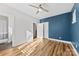 Bedroom features hardwood floors, a ceiling fan, and two closets at 327 Coxe Ave, Charlotte, NC 28208