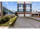 Modern two-story home featuring a concrete driveway, two-car garage, and contemporary design at 327 Coxe Ave, Charlotte, NC 28208