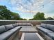 Stylish rooftop terrace with comfortable seating and atmospheric string lights at 327 Coxe Ave, Charlotte, NC 28208