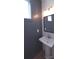 Contemporary powder room with a pedestal sink, modern fixtures, and gray walls at 327 Coxe Ave, Charlotte, NC 28208