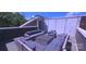 This rooftop deck features ample seating with a large sectional sofa and string lights creating a cozy atmosphere at 327 Coxe Ave, Charlotte, NC 28208