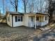 Yellow ranch home with covered porch and white railings at 3798 Providence Mill Rd, Maiden, NC 28650