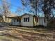 House exterior showcasing a yellow ranch home with a porch at 3798 Providence Mill Rd, Maiden, NC 28650