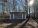 Rustic wooden outbuilding with green shutters at 3798 Providence Mill Rd, Maiden, NC 28650