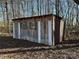 Rustic wooden outbuilding with green shutters at 3798 Providence Mill Rd, Maiden, NC 28650