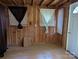 Charming sunroom with wood walls and light colored curtains at 3798 Providence Mill Rd, Maiden, NC 28650